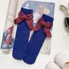 Calcetines de verano para bebé nuevo lazo color liso calcetines de tubo finos rayados calcetines para niños fabricantes venta al por mayor