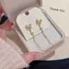 Brincos longos com franja e pingente de borboleta e gota d'água, estilo nicho de luxo leve de alta qualidade, pino de prata S925, brincos requintados e elegantes