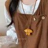 ¡¡¡Súper lindo!!! Collar Colgante Perro Globo M&M Rojo para Mujer, Nuevo Accesorio de Cadena para Suéter de Alta Gama Otoño e Invierno 2025