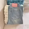 Calça Jeans de Cintura Alta Reta Versátil com Caimento Largo e Tag de Couro de Personalidade Estilo Americano para Mulheres, Primavera e Outono