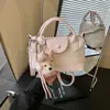 Bolso de mano moderno, casual, elegante y único con una textura sencilla, nuevo bolso de hombro y cruzado para mujer primavera 2026