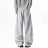 Outono 2026 Nova Marca Tendência Masculina Calça Jogger Masculina Desconstruída com Costura Lateral Bordada de Estrela Estilo Coreano High Street Calça Longa Curva