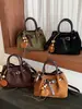 Bolso de diseño único para mujer, nuevo bolso cubo retro estilo coreano de ante, elegante bolso de hombro y bolso cruzado