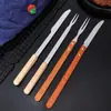 Juego de cuchillo y tenedor para barbacoa de acero inoxidable tenedor de barbacoa cuchillo y tenedor para pierna de cordero asada mango de madera mango plano mango redondo con mango largo cuchillo y tenedor al por mayor