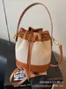 Bolsos de Diseño Nicho para Mujer 2025 Nuevo Verano Versátil Super Popular Bolso Cruzado Estilo Coreano Cordón Mini Bolso Cubo