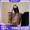 Bolso de mano transfronterizo para mujer, de gran capacidad, nuevo estilo 2024, bolso de hombro de alta gama para otoño, bolso general para estudiantes universitarios.