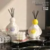 Ornamento aromático em formato de coelho de orelhas caídas segurando uma flor com porta-velas, adequado para quarto, escrivaninha e decoração de casa, criando uma atmosfera aconchegante, uma ótima decoração de presente para casa