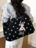Bolso de mano de lona con lunares de gran capacidad para mujer, nuevo modelo 2026, de alta gama, lujo ligero, bolsa tote de nicho para el trabajo