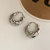 Pendientes retorcidos de moda transfronteriza europea y americana, estilo ins exquisito, lujo ligero, alta gama, elegantes, versátiles, accesorios para orejas de nicho para mujer