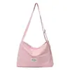 Bolso de lona casual de nicho, bolso de hombro de nailon, bolso cruzado deportivo, bolso de retazos versátil y elegante para el día a día