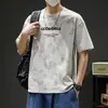 Algodón Nuevo Verano Hombres Moderno Holgado Marca de Moda Estudiante Camiseta de Manga Corta Top con Mangas Tres Cuartos y Cuello Redondo