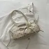 Colección nueva 2026: bolso de axila con lazo de nicho para mujer, bolso de hombro de lunares moderno y versátil para otoño e invierno, adecuado para el trabajo y los desplazamientos
