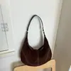Bolso pequeño vintage de gamuza para mujer, nuevo estilo 2026, bolso relajado tipo albóndiga mate, bolso de axila de alta gama para commuting de otoño e invierno