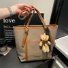 Bolsa Grande Capacidade Transfronteiriça Feminina Outono 2026 Nova Versátil Moda Ombro Único Bloco de Cores Comute Retrô Casual Bolsa Tote
