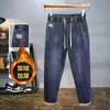 Nuevos pantalones casuales de otoño e invierno, cintura elástica moderna, forro polar, jeans de mezclilla engrosados, pantalones de algodón holgados elásticos ajustados para hombre
