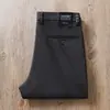 Estación europea otoño e invierno algodón modal sarga microelástico simple negocios lavado cintura media ajuste recto pantalones casuales para hombre