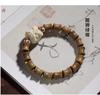 Agita el sonido de la misma nueva pulsera china de sándalo verde natural original de sándalo alrededor de los dedos de suaves cuentas de Buda flor de loto femenina alrededor del edificio