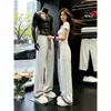 Pantalones de chándal rectos de retazos a cuadros blancos y grises para hombre, diseño de otoño de peso pesado, pantalones ligeramente acampanados, pantalones deportivos casuales americanos