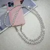 Correa de teléfono de perlas y diamantes para llevar cruzada, cadena de teléfono cruzada estilo diosa anti-pérdida, nueva correa de perlas de alta gama