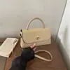 Bolso tote de PU grande de estilo coreano para viajes transfronterizos, nuevo modelo de lujo 2026 con cierre de hebilla, simple y moderno, para el día a día, bolso de hombro y bolso cruzado