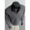 Sudadera negra de dos piezas simuladas con cuello de camisa para hombre, otoño e invierno, corte limpio, alta gama, estilo universitario, top tipo polo de manga larga