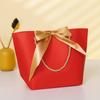 Bolsa de papel portátil ins bow al por mayor bolsa de regalo de Año Nuevo bolsa pequeña para cosméticos bolsa para ropa logotipo imprimible