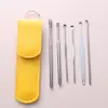 Venta al por mayor del fabricante Juego de seis piezas de herramientas para quitar cera del oído de acero inoxidable, Juego de cucharas para el oído con estuche de cuero, Limpiador de oídos portátil