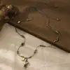 2026 Collar Retro de Cuerda Tejida a Mano con Cuentas de Acero de Titanio para Mujer Diseño de Nicho Estilo Étnico Cadena para Suéter Accesorios de Flor