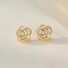 Brincos de Camélia com Pino de Prata S925 Brincos Retrô com Pedra Olho de Gato Sensação Avançada Elegante Celebridade da Internet Versátil Brincos Estilo Hong Kong