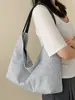 Bolsa de mano a rayas casual estilo coreano Shuai Mi Jia para mujer, modelo nuevo 2026, bolso de hombro de gran capacidad para estudiantes que van a clase