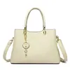 Moda Feminina Coreana Nova Outono/Inverno 2026 Bolsa Transfronteiriça Bolsa de Maternidade Portátil Tendência Bolsa de Ombro Único Transversal Grande Capacidade com Múltiplas Camadas