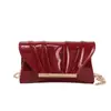 2026 Nova Bolsa de Mão Plissada Dourada Brilhante de Luxo Leve Bolsa Quadrada Pequena Design de Nicho Moderna Bolsa de Ombro Único Transversal
