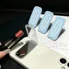 Espejo fresco estilo ins minimalista para teléfono de escritorio, diseño de nube en inglés, lindo y femenino, plegable, estilo nicho, disponible para venta al por mayor