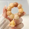 Pulseira de Raiz de Bodhi em Formato de Coração com Patas de Gato e Dentes de Alho Esculpidos, um Brinquedo Macio para Aliviar o Estresse para Meninas Brincarem e Girarem nos Dedos