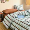 Set de Cuatro Piezas de Algodón Lavado Estilo Nuevo 2026 Sábana Nórdica y Funda de Edredón para Estudiantes de Dormitorio en la Temporada de Regreso a Clases, Lavable a Máquina