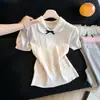 Top de punto trenzado color albaricoque con cuello de muñeca y manga corta para mujer, nuevo de verano 2026, ajuste ceñido, cintura estrecha, cuello vuelto, top corto