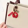 Llavero de Audífonos con Pedrería de Cristal Llavero Musical Completamente Cubierto de Pedrería Adorno Colgante de Cuerda de Diamante para Bolso Accesorios Llavero de Coche
