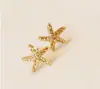 Venta directa de fábrica Yiwu aretes florales de perlas y pedrería lindos aretes de estrella de mar de tres piezas joyería para el oído al por mayor