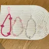 Colgante de Lentejuelas Rosa Fresco y Dulce Estilo Girly Cadena para Teléfono Móvil con Lazo Cordón con Lazo de Flor de Tulipán Colgante para Bolso
