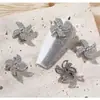 Artistas de uñas de moda joyería de circonita flor giratoria molino de viento tridimensional súper brillante cristal de circonita mariposa decoración de uñas fabricantes