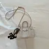 Bolso de mano tejido de estilo coreano de alta moda para mujer, otoño temprano 2026, bolso tote pequeño, bolso de hombro tipo cubo elegante y simple