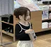 Conjunto de Duas Peças para Meninas Primavera 2026 Novo Estilo Conjunto de Blusa de Manga Longa e Calça Cargo para Meninas Calças Largas Estilosas para Bebês