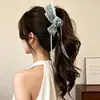 Pinza Plátano Plisada Vertical con Lazo Floral para Cola de Caballo de Verano 2026 Nuevos Pasadores para la Parte Posterior de la Cabeza Accesorios para el Cabello