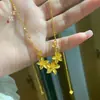 Collar de oro con diseño de flor de la felicidad, estilo arena y oro, para bodas, de nicho, a la moda, joyería femenina que combina con todo para novias.