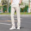 Pantalones casuales para hombre 2026 nuevo estilo todas las estaciones de negocios pierna recta holgados color liso versátiles pantalones largos pantalones deportivos de otoño para hombre
