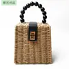 Bolso tejido de ratán ins para mujer literaria portátil de paja retro bolso tejido de ratán cesta tejida indonesia bolso de moda casual venta al por mayor