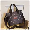 Bolso de mano de lunares elegante transfronterizo para mujer, nuevo bolso casual de tela Oxford de gran capacidad para el hombro y cruzado