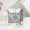 Bolsas de Alta Gama Verano 2025 Nueva Bolso Mini Cuadrado Portátil para Mujer Moda y Versátil Cruzado Teléfono Móvil Periódico