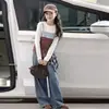 Camisa de manga larga en capas para niña, estilo otoño, versión coreana, top a rayas versátil, para niños pequeños, directo de fábrica