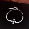 Pulsera de cordón con colgante de cruz de circonita, sensación de lujo ligero de alta gama, diseño de nicho a la moda, accesorio de mano único